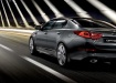 Kia Optima - вид сзади в движении
