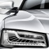 Audi S8 крупным планом передняя часть: фара, решётка радиатора