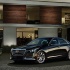 Cadillac CTS - официальное фото автомобиля возле частного дома