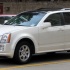 Cadillac SRX - первое поколение в белом цвете